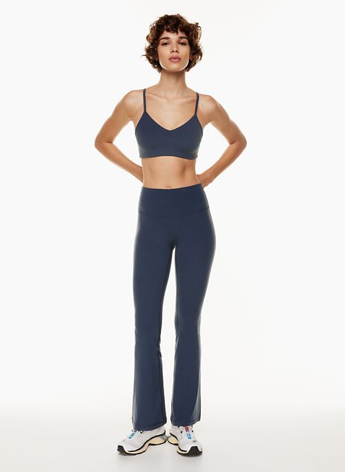 Navy sports flare pants with slit for women, ankle length gym pants.