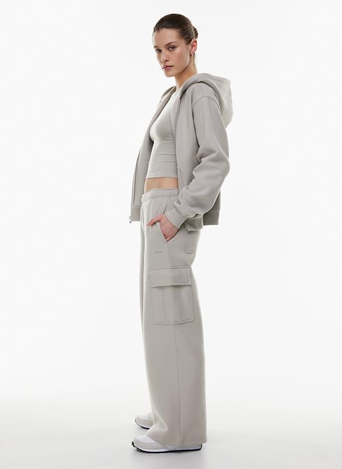 One of my favourite aritzia pieces ever! They are ASS PANTS. Wilfred Free  Free Lounge Sweatpant, Grey Taupe, XS. (Got them last spring when they were  called Pisces Sweatpant.) They do pill