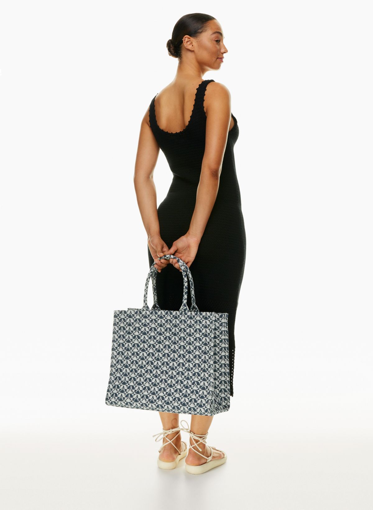 Luxury women's bags - Black tote bag with star-shaped stitching