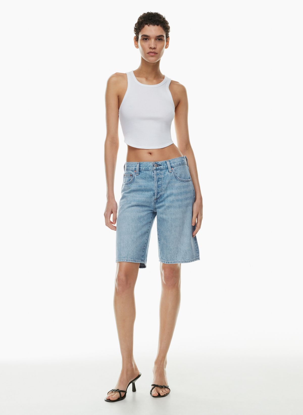 jean shorts worn with black hose  90s fashion, 90s high waisted jeans, 90s  fashion outfits